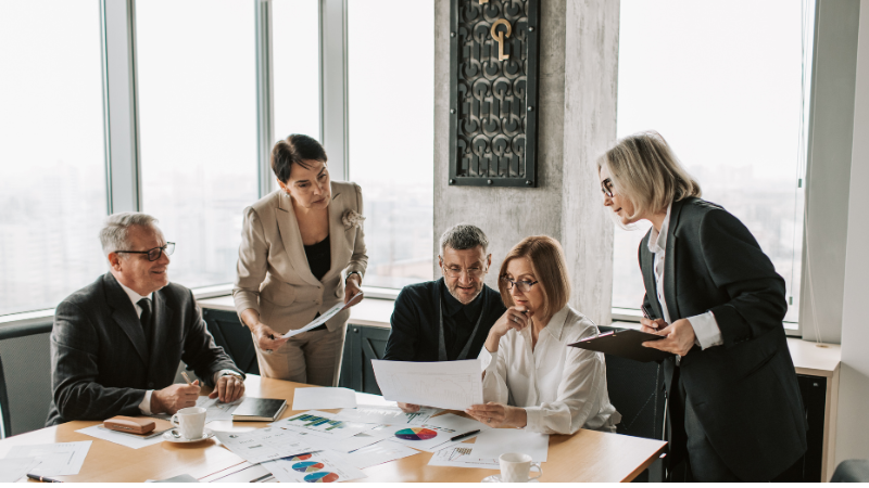 Team reviewing Zoho automation features for SMEs to improve productivity and workflows
